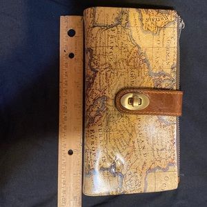 Beautiful Patricia Nash wallet with strap.